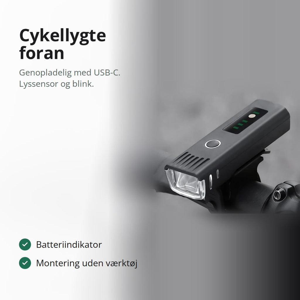 Sort cykellygte foran monteret på styret, med teksten: genopladelig med USB-C, lyssensor og blink, batteriindikator, montering uden værktøj