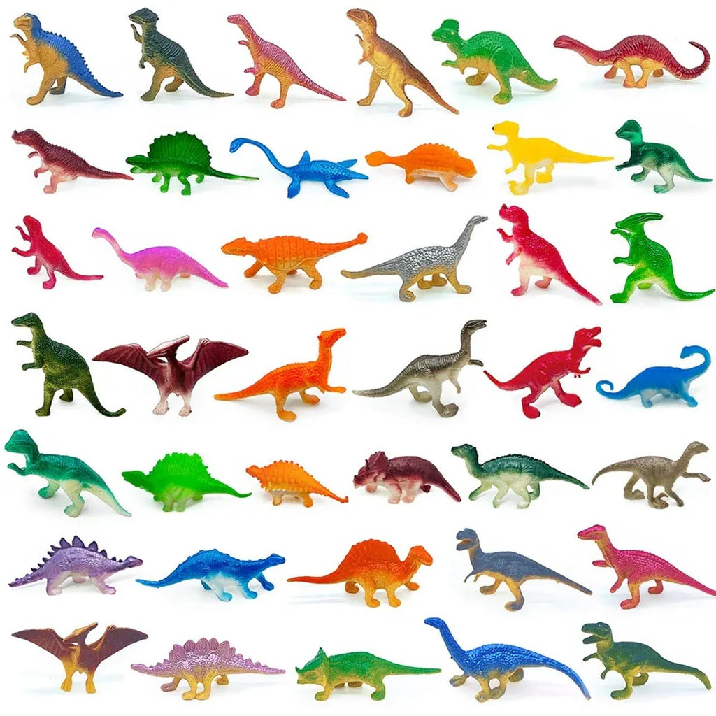 Et udvalg af dinosaurfigurerne lagt ud i rækker på hvid baggrund i mange farver og former
