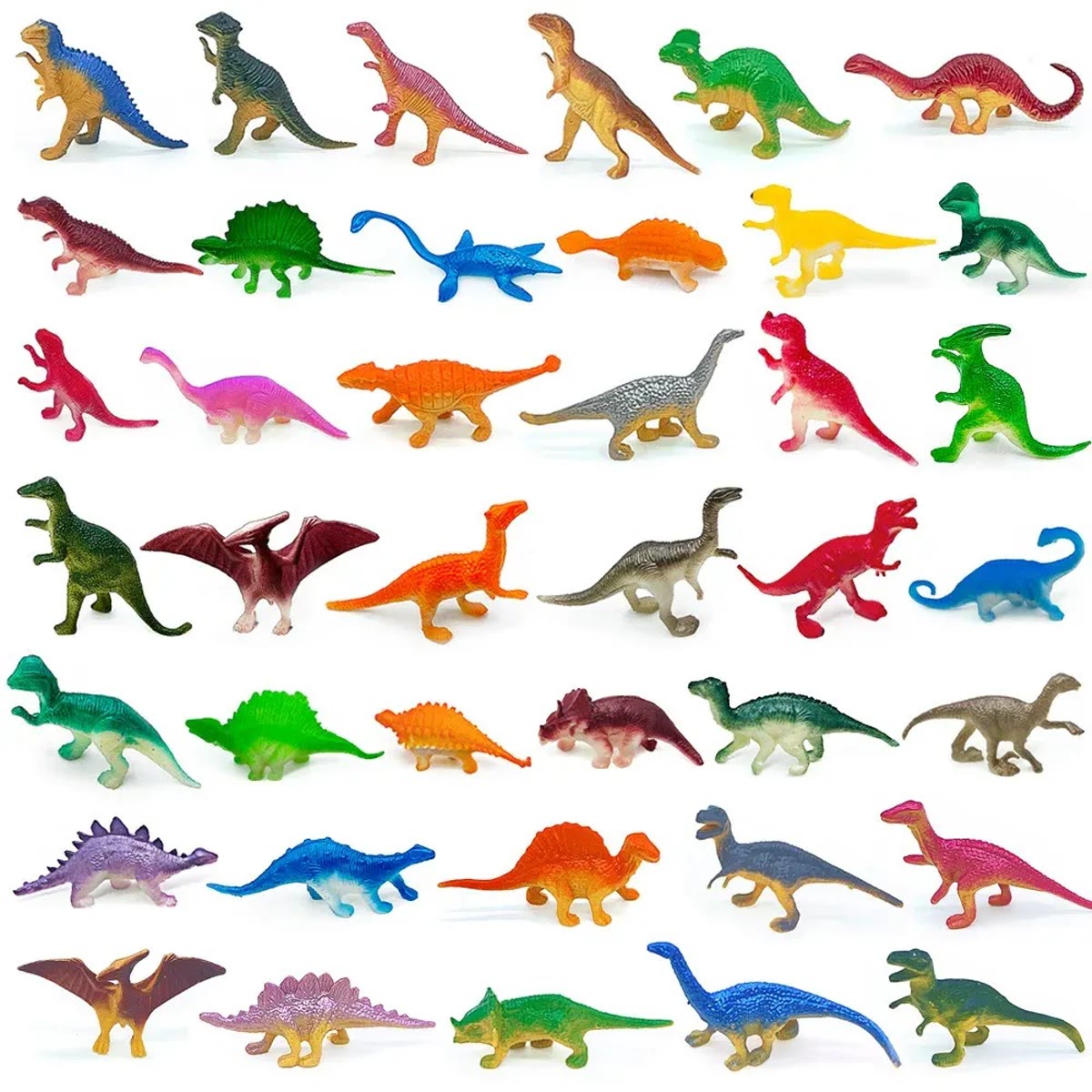 Et udvalg af dinosaurfigurerne lagt ud i rækker på hvid baggrund i mange farver og former