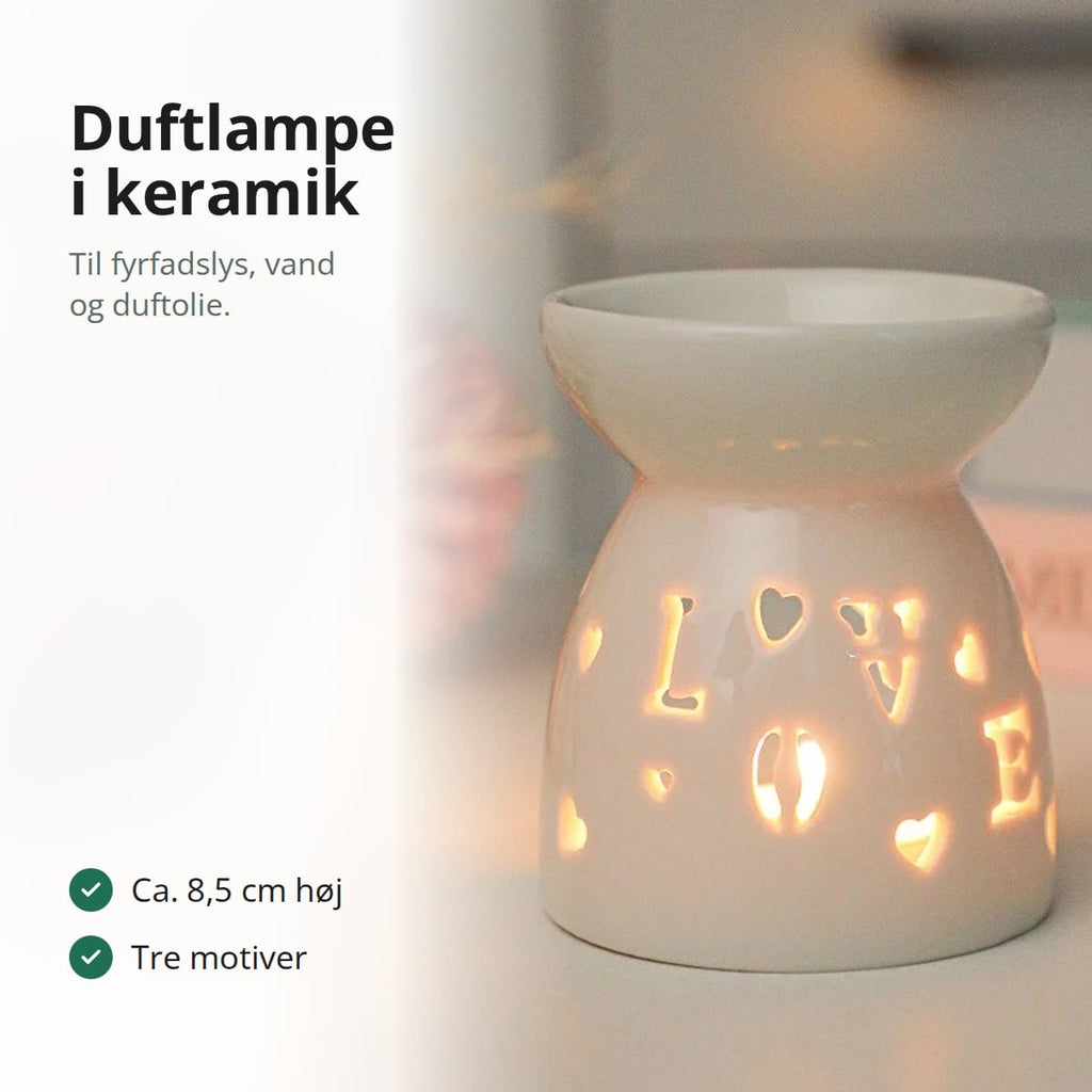 Tændt duftlampe i hvid keramik med LOVE og hjerter skåret ud