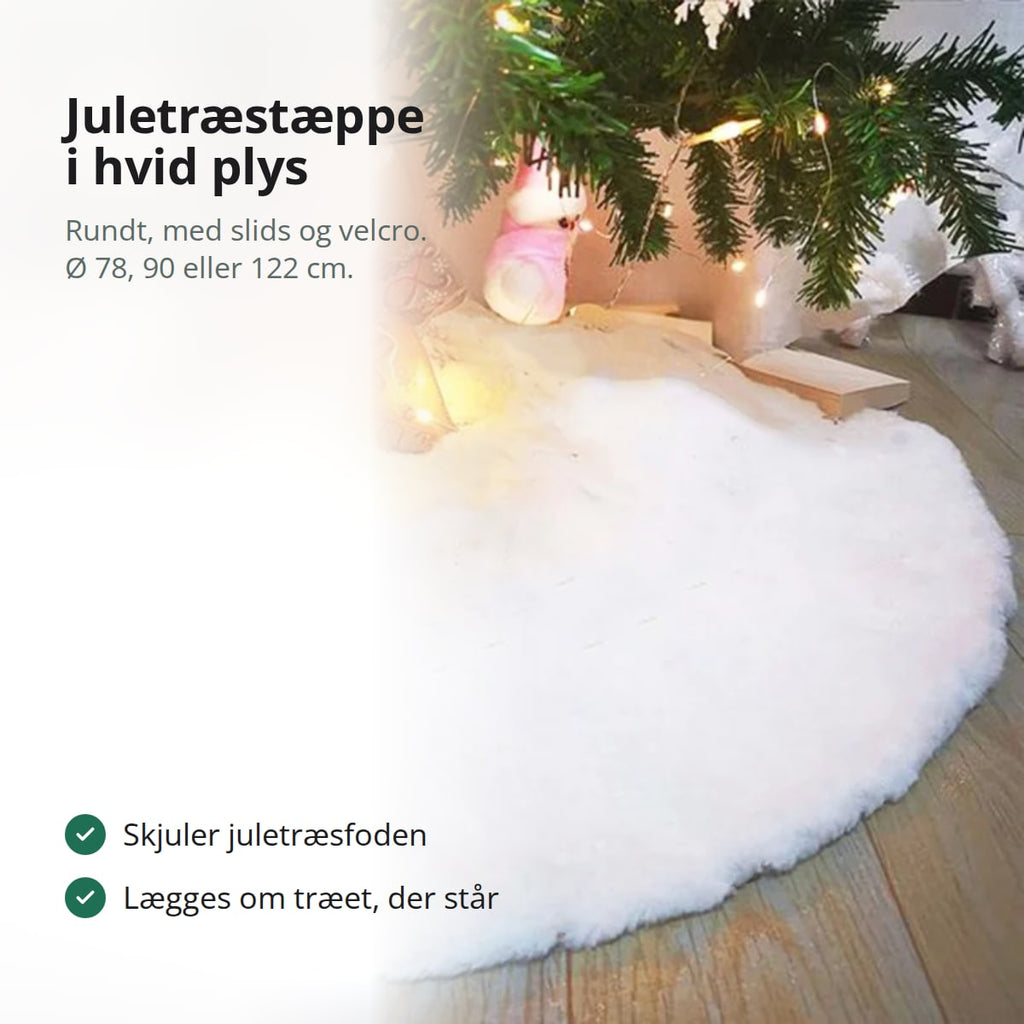 Juletræstæppe i hvid plys omkring foden af et juletræ