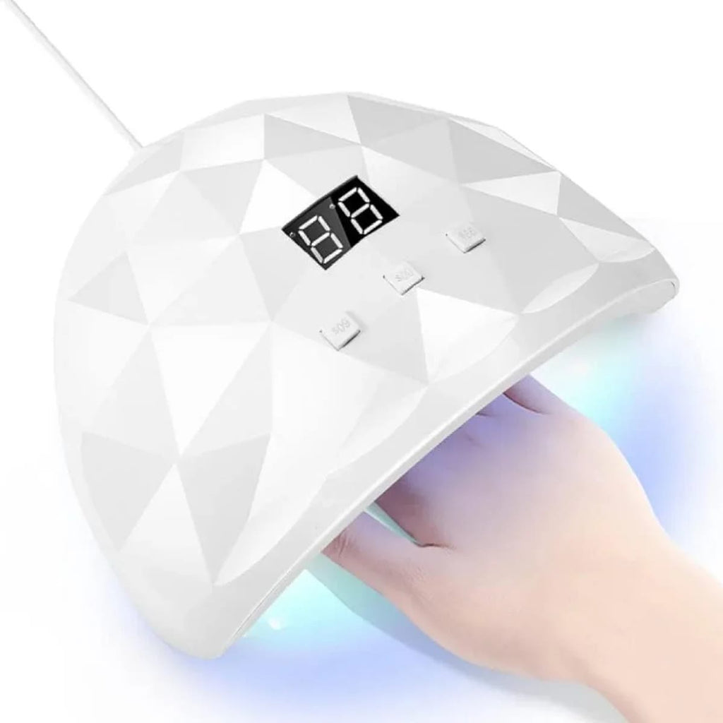Hvid UV-lampe til negle med display over en hånd