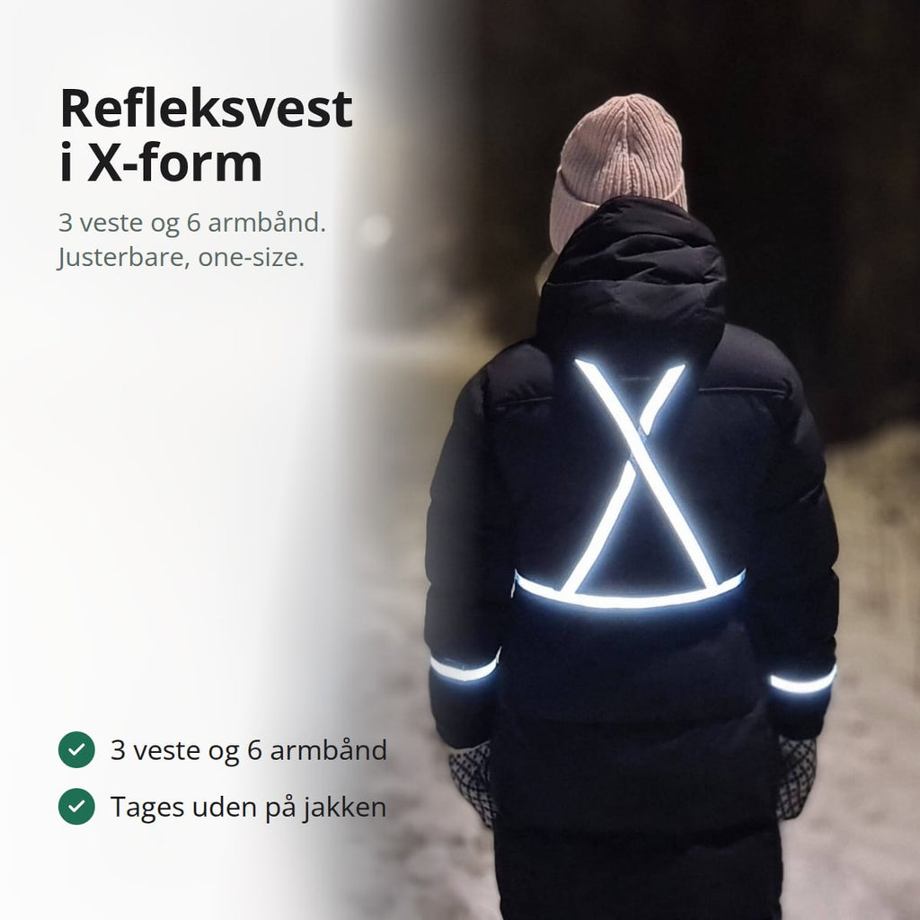 Refleksvest i X-form, der lyser på ryggen af en person i mørk vinterjakke om aftenen