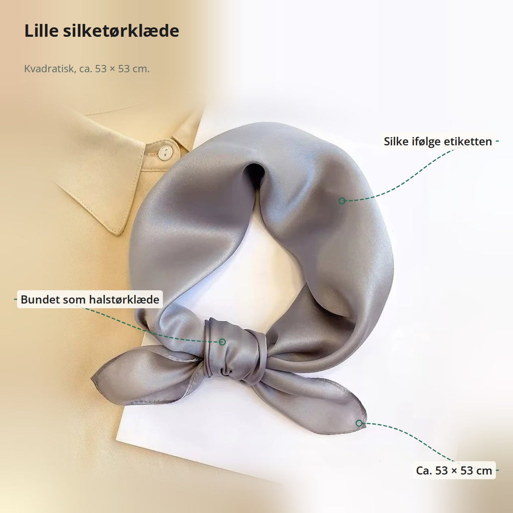 Gråt silketørklæde med markeringer: silke ifølge etiketten, bundet som halstørklæde og ca. 53 × 53 cm