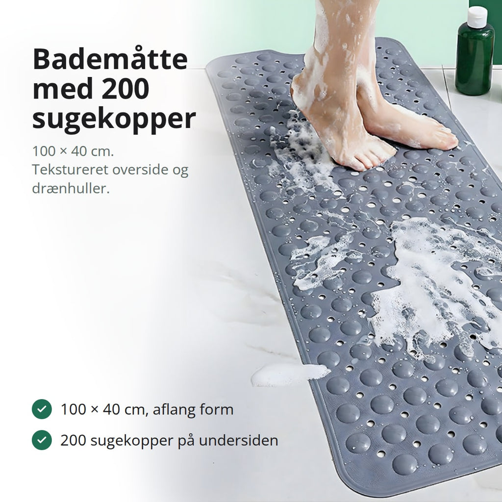 Skridsikker bademåtte med knopper og drænhuller i et badekar, med fødder på måtten