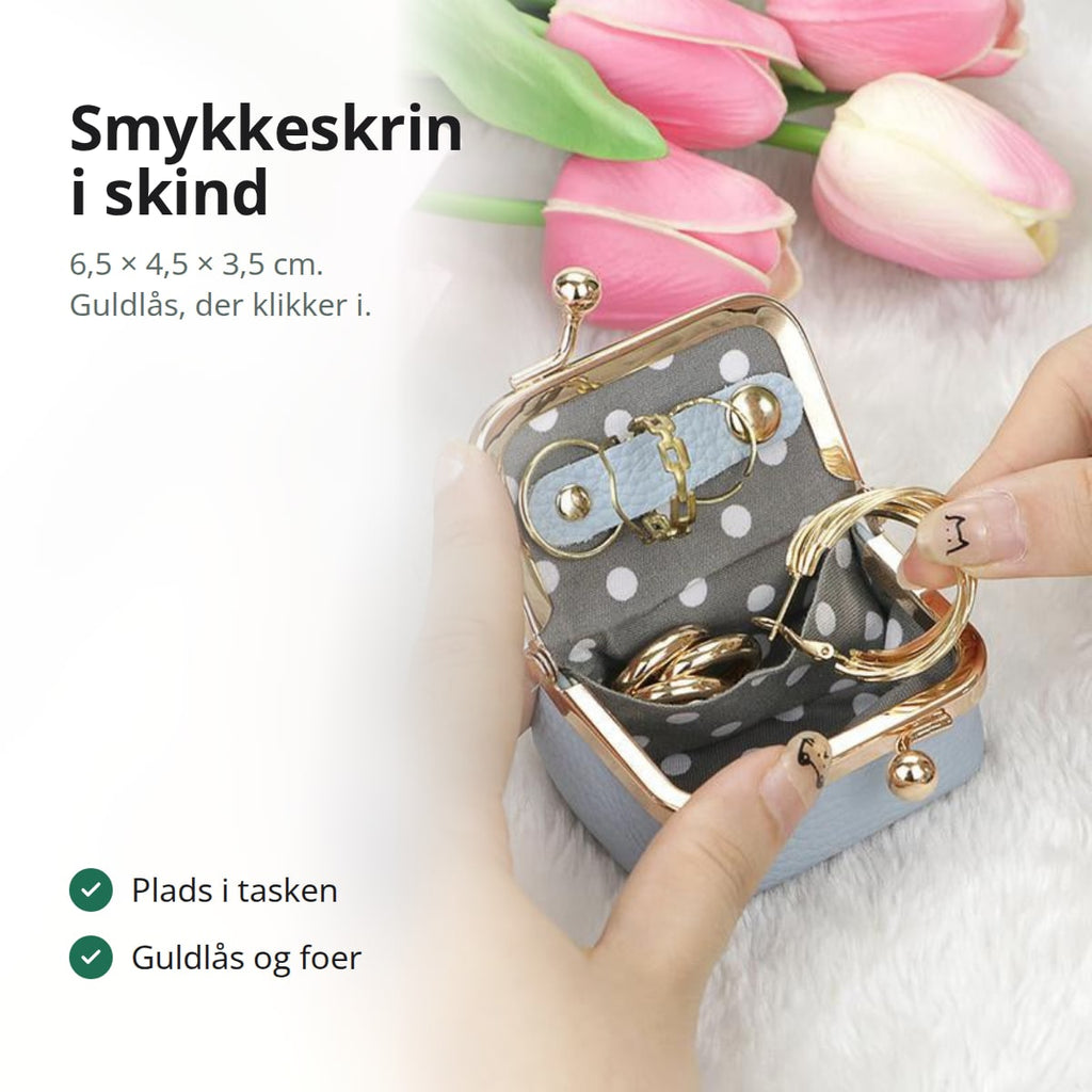 Lille smykkeskrin i skind med guldlås