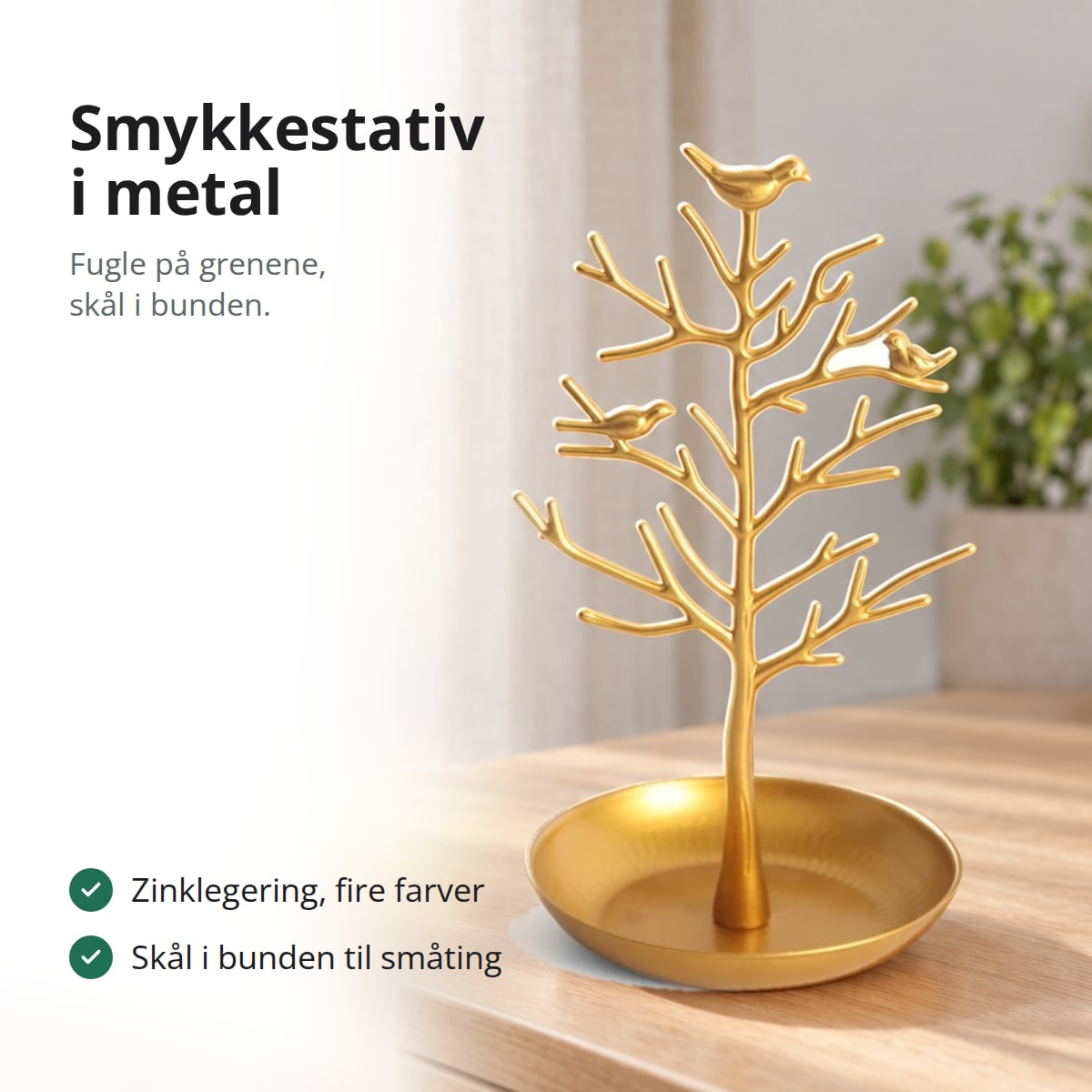Smykkestativ i metal med fugle på grenene og skål i bunden, med tekst: zinklegering i fire farver